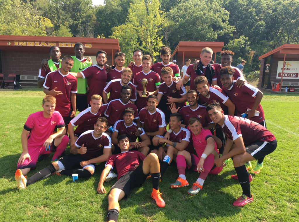 Men's Soccer Team Group Photo celebrating game win.